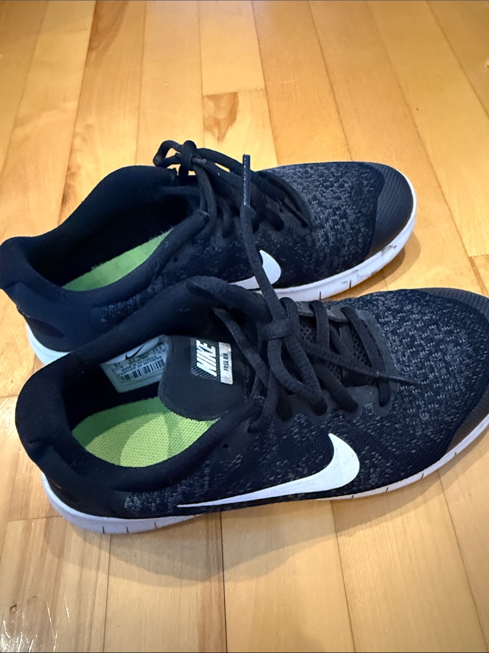 Nike Black Knit Sneakers with White Swoosh and Green Insole